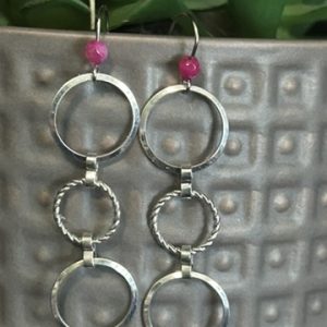 Silver ring dangles